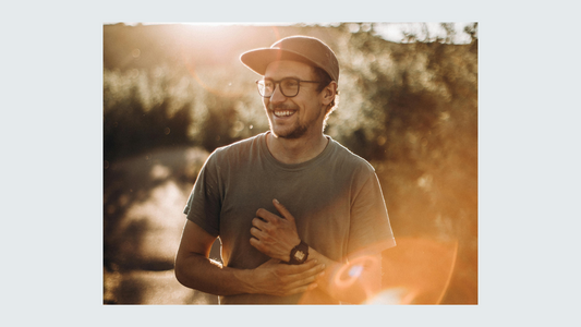 Man in cap smiling 