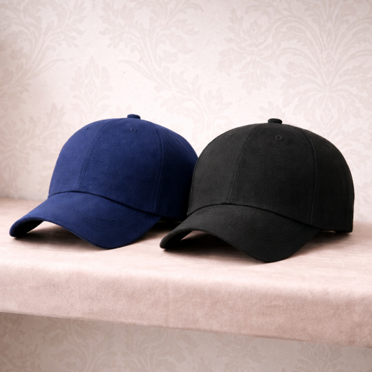 Navy and black classic baseball caps on a pink shop shelf 