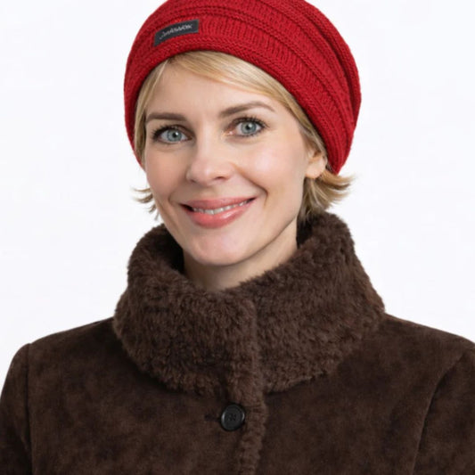 Blonde woman in red slouch beanie 