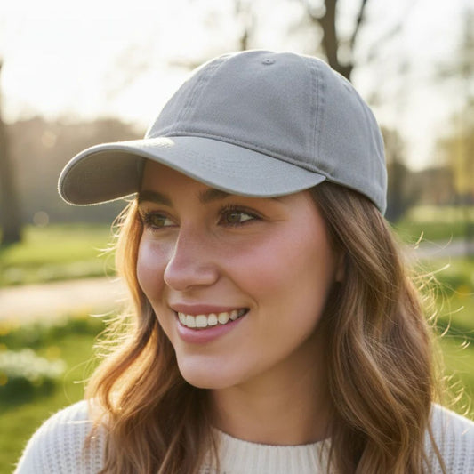 Woman in grey baseball cap 