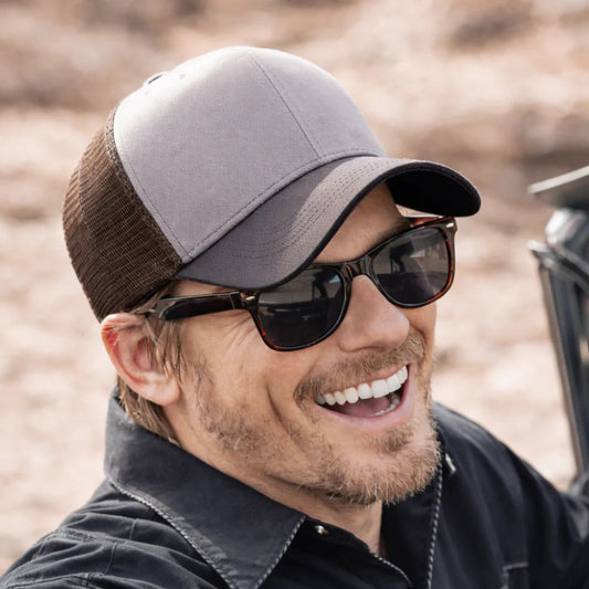 Man in trucker cap and sunglasses 