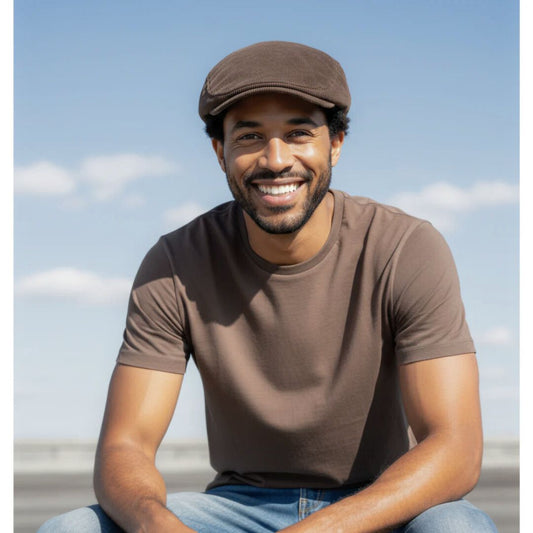 Man in brown corduroy cap and tee shirt 