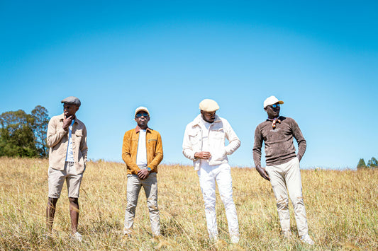 Four men in caps