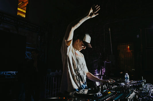 DJ with his arm in the air